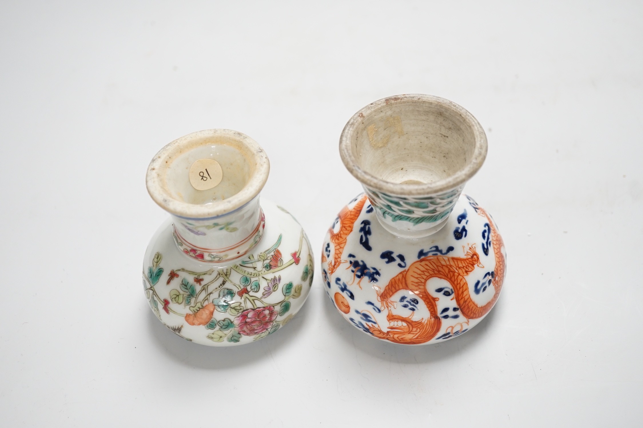 Two 19th century Chinese enamelled porcelain stem bowls, The first painted with Dragons chasing a flaming pearl, 10cm, the second painted with a bird amid flowers